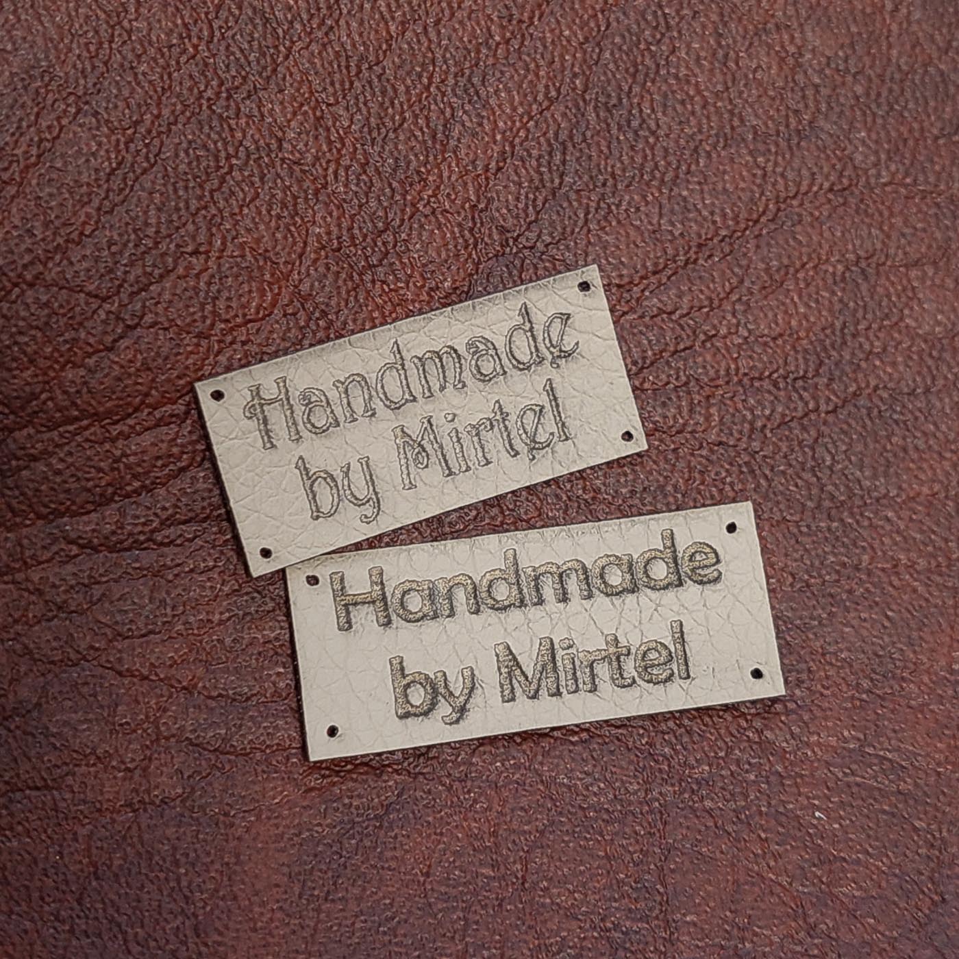 Beež kunstnahast eritellimus silt oma logo või kujundusega