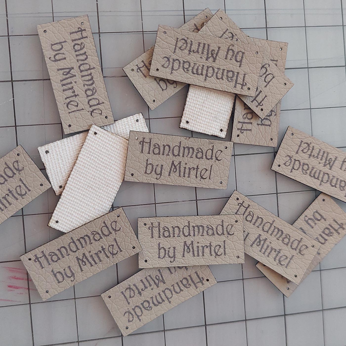 Beež kunstnahast eritellimus silt oma logo või kujundusega